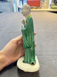 A Chinese verte biscuit Luohan holding a ruyi, Kangxi