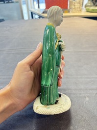 A Chinese verte biscuit Luohan holding a ruyi, Kangxi
