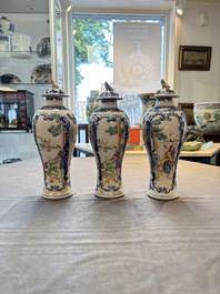 Three Chinese famille rose 'mandarin subject' vases and covers, Qianlong