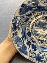 A Chinese blue and white lobed 'phoenix and monkey' plate, flower mark, Kangxi
