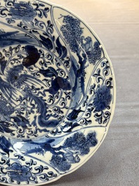 A Chinese blue and white lobed 'phoenix and monkey' plate, flower mark, Kangxi