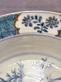 Four Chinese doucai plates with birds among bamboo and floral design, 18th C.