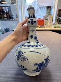 A Chinese blue and white bottle vase with floral design, Transitional period