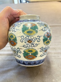 A pair of Chinese doucai 'chrysanthemum' jars and covers, Daoguang mark and of the period