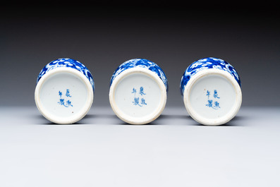 Three Chinese blue and white 'plum blossom' vases and covers, Kangxi mark, 19th C.