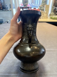 A Chinese archaistic bronze vase with 'mythical beast' handles, Yuan/Ming