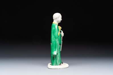 A Chinese verte biscuit Luohan holding a ruyi, Kangxi