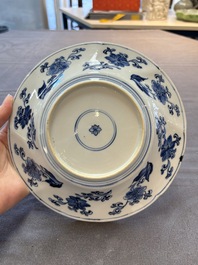 A Chinese blue and white lobed 'phoenix and monkey' plate, flower mark, Kangxi