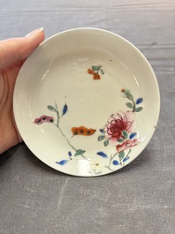 Seven Chinese famille rose cups and eleven saucers with floral design, Qianlong
