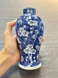 Three Chinese blue and white 'plum blossom' vases and covers, Kangxi mark, 19th C.