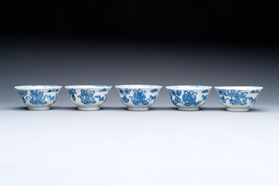 Five Chinese blue and white cups and saucers, Kangxi mark, 19th C.