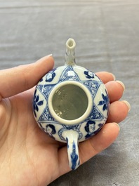 Three Chinese blue and white teapots, a cup and a saucer, Kangxi
