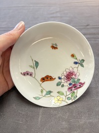 Seven Chinese famille rose cups and eleven saucers with floral design, Qianlong