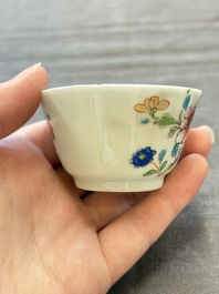 Seven Chinese famille rose cups and eleven saucers with floral design, Qianlong