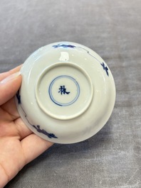 Three Chinese blue and white teapots, a cup and a saucer, Kangxi