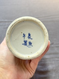Three Chinese blue and white 'plum blossom' vases and covers, Kangxi mark, 19th C.