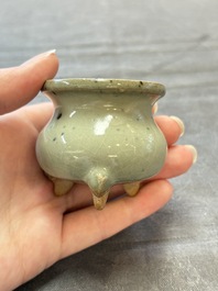 A small Chinese green-glazed 'jun' tripod censer, Hebi kilns, Song/Yuan