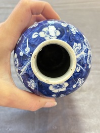 Three Chinese blue and white 'plum blossom' vases and covers, Kangxi mark, 19th C.