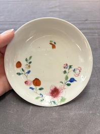 Seven Chinese famille rose cups and eleven saucers with floral design, Qianlong