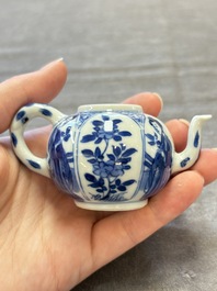 Three Chinese blue and white teapots, a cup and a saucer, Kangxi