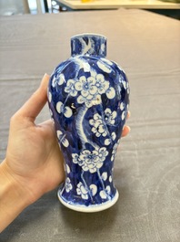Three Chinese blue and white 'plum blossom' vases and covers, Kangxi mark, 19th C.