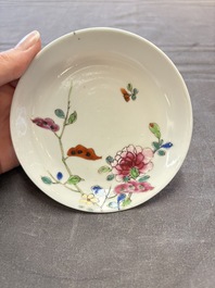 Seven Chinese famille rose cups and eleven saucers with floral design, Qianlong