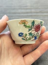 Seven Chinese famille rose cups and eleven saucers with floral design, Qianlong