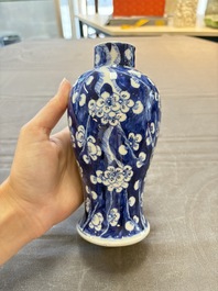 Three Chinese blue and white 'plum blossom' vases and covers, Kangxi mark, 19th C.