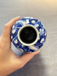 Three Chinese blue and white 'plum blossom' vases and covers, Kangxi mark, 19th C.