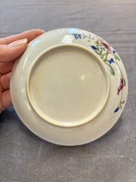 Seven Chinese famille rose cups and eleven saucers with floral design, Qianlong
