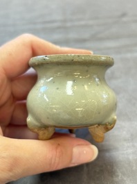 A small Chinese green-glazed 'jun' tripod censer, Hebi kilns, Song/Yuan