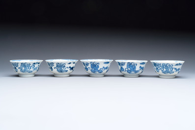 Five Chinese blue and white cups and saucers, Kangxi mark, 19th C.