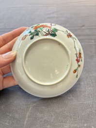 Seven Chinese famille rose cups and eleven saucers with floral design, Qianlong