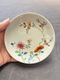 Seven Chinese famille rose cups and eleven saucers with floral design, Qianlong