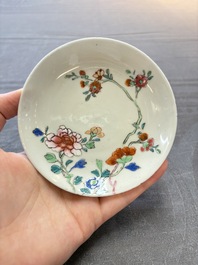 Seven Chinese famille rose cups and eleven saucers with floral design, Qianlong
