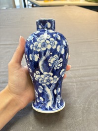 Three Chinese blue and white 'plum blossom' vases and covers, Kangxi mark, 19th C.