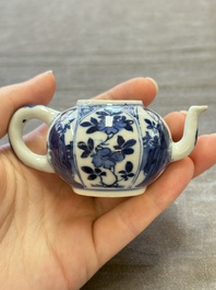 Three Chinese blue and white teapots, a cup and a saucer, Kangxi