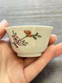 Seven Chinese famille rose cups and eleven saucers with floral design, Qianlong