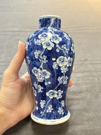 Three Chinese blue and white 'plum blossom' vases and covers, Kangxi mark, 19th C.