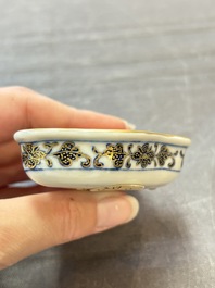 A Chinese blue, white and iron-red gilt-decorated conch-form ink palette with landscape design, Jiaqing mark and of the period