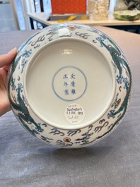 A Chinese doucai 'dragon' plate, Yongzheng mark and of the period