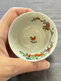 Seven Chinese famille rose cups and eleven saucers with floral design, Qianlong