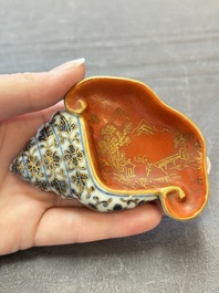 A Chinese blue, white and iron-red gilt-decorated conch-form ink palette with landscape design, Jiaqing mark and of the period