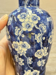 Three Chinese blue and white 'plum blossom' vases and covers, Kangxi mark, 19th C.
