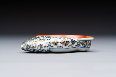 A Chinese blue, white and iron-red gilt-decorated conch-form ink palette with landscape design, Jiaqing mark and of the period