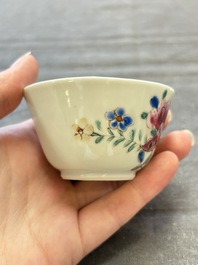 Seven Chinese famille rose cups and eleven saucers with floral design, Qianlong