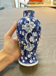 Three Chinese blue and white 'plum blossom' vases and covers, Kangxi mark, 19th C.