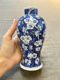 Three Chinese blue and white 'plum blossom' vases and covers, Kangxi mark, 19th C.