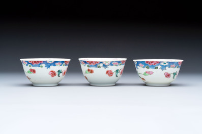 Three Chinese famille rose cups and saucers with a duck among flowering branches, Yongzheng/Qianlong