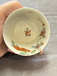 Seven Chinese famille rose cups and eleven saucers with floral design, Qianlong